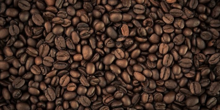 Coffee beans closeup background ( Filtered image processed vintage effect. )