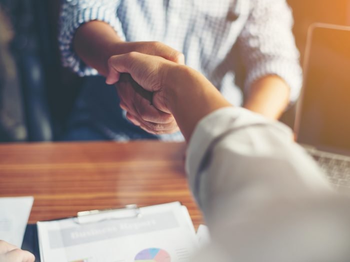 Business People Handshake Greeting Deal at work.