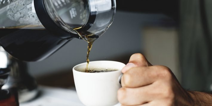 Pouring hot coffee drink